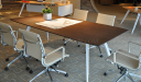 modern office with meeting table and sleek leather chairs