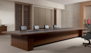 classy boardroom with large meeting table and leather chairs