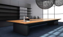 modern office with large conference table in zebra veneer finish