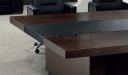 meeting table top in dark wood and black leather