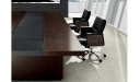 conference table in dark wood with black leather chairs