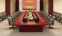 large conference room with meeting table and leather chairs