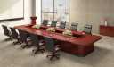elegant boardroom with large table and black leather chairs