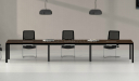 long meeting table with black chairs