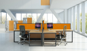 L shape workstations with orange color partitions
