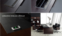 dark wood office table with embedded wireless mobile charger