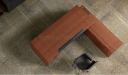 top view of L shape office desk in natural wood finish