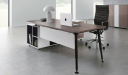 modern office with desk, side cabinet and black leather chair