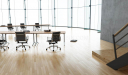 wooden floored hall with training table and chairs