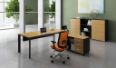 office cabin with L shaped office desk with orange chair
