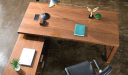 top view of L shape office desk in walnut veneer