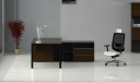 side view of black glass office desk with side cabinet