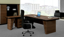 inside view of walnut finish L shape office table with black leather chair
