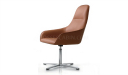 revolving lounge chair in tan leather with stainless steel base