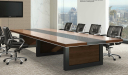 boardroom with walnut finish conference table and black leather chairs