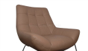 close up view of beige leather lounge chair