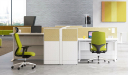 office with cubicles and office chair in green fabric upholstery
