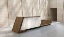 reception area with a beige back drop and large reception table