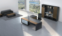contemporary office space with large office table, chair and rear storage unit