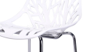 close up view of white cafeteria chair with laser cut pattern seat