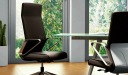 modern office with sleek office chair in brown leather