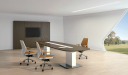 video conference room with oval shape conference table and leather chairs