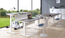 modern office furnished with various height adjustable desks