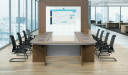 boardroom with U shape conference table and black chairs