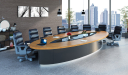 large boardroom with oval shape table and chairs