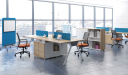 Office with workstations in light wood and chairs