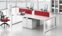 a four seater modular workstation system in white laminate with storage