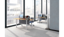 office with rows of height adjustable workstations