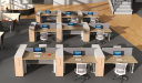 work are with rows of height adjustable workstations