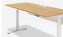 height adjustable workstation with light oak desk top and white metal legs
