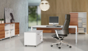 contemporary office cabin with white desk and black leather chair