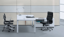 modern office desk in white color with side cabinet and black chairs